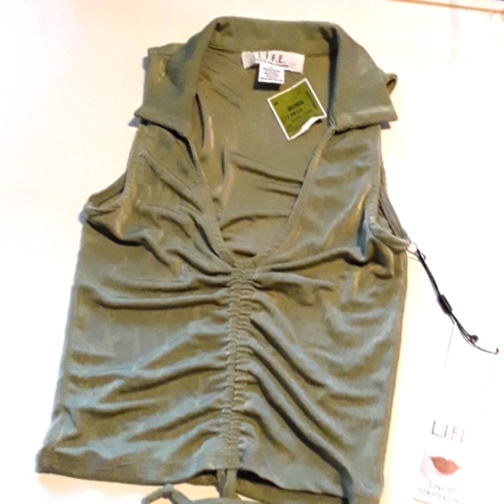 A Small forest green v neck top that is adjustable in the front